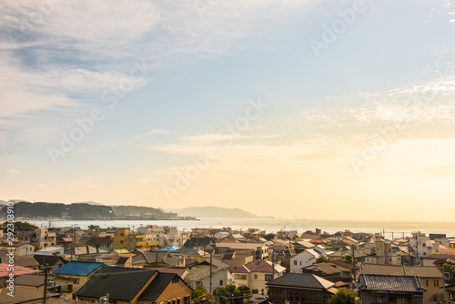 View of Yuigahama Beach and Sagami bay in late afternoon when looking from the viewpoint of Hase-dera temple at Kamakura. Kanagawa,Japan.