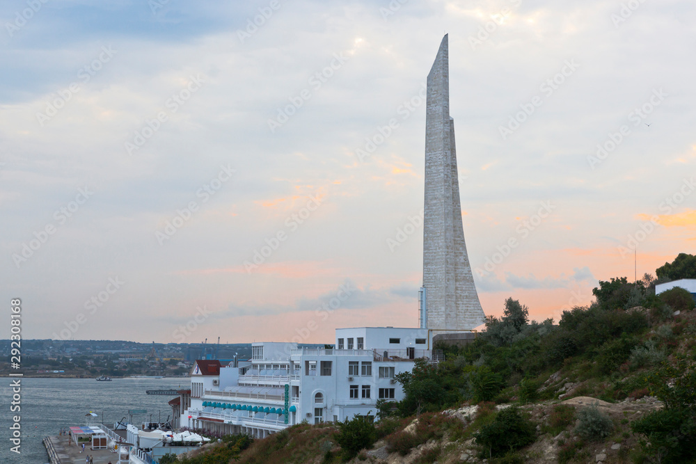 Cape Khrustalny with an obelisk to the Hero City of Sevastopol on an early summer morning, Crimea