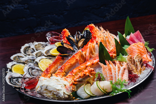 Seafood platter. Seafood on a large plate. Assorted seafood from mussels, oysters, crab, shrimp