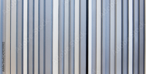 Wall style pattern vertical dark and light white gray and black color made of wood. Background, wallpaper, and texture.