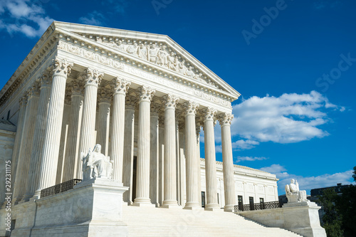 Supreme Court of the United States building front entrance with a scenic view of columns and steps under bright summer sun in Washington DC, USA photo