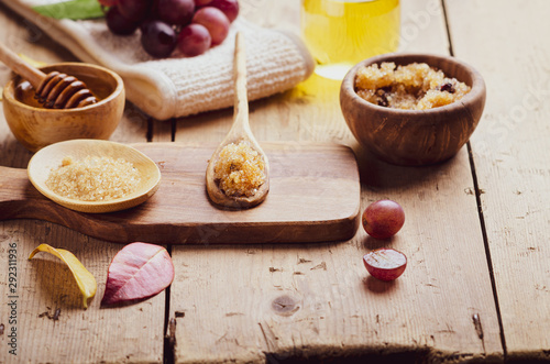 Ingredients for body scrub of brown sugar with grape and  oil, eco bio friendly cosmetic for skin care.