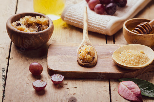 Ingredients for body scrub of brown sugar with grape and  oil, eco bio friendly cosmetic for skin care.