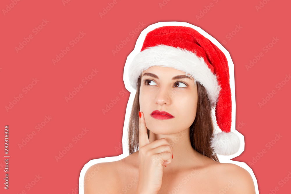 portrait of thinking and reflecting girl in a Christmas hat. emotional woman in red santa claus hat Magazine collage style with trendy color background. Happy Christmas and New Year holidays concept portrait of thinking and reflecting girl in a Christmas hat. emotional woman in red santa claus hat Magazine collage style with trendy color background. Happy Christmas and New Year holidays concept