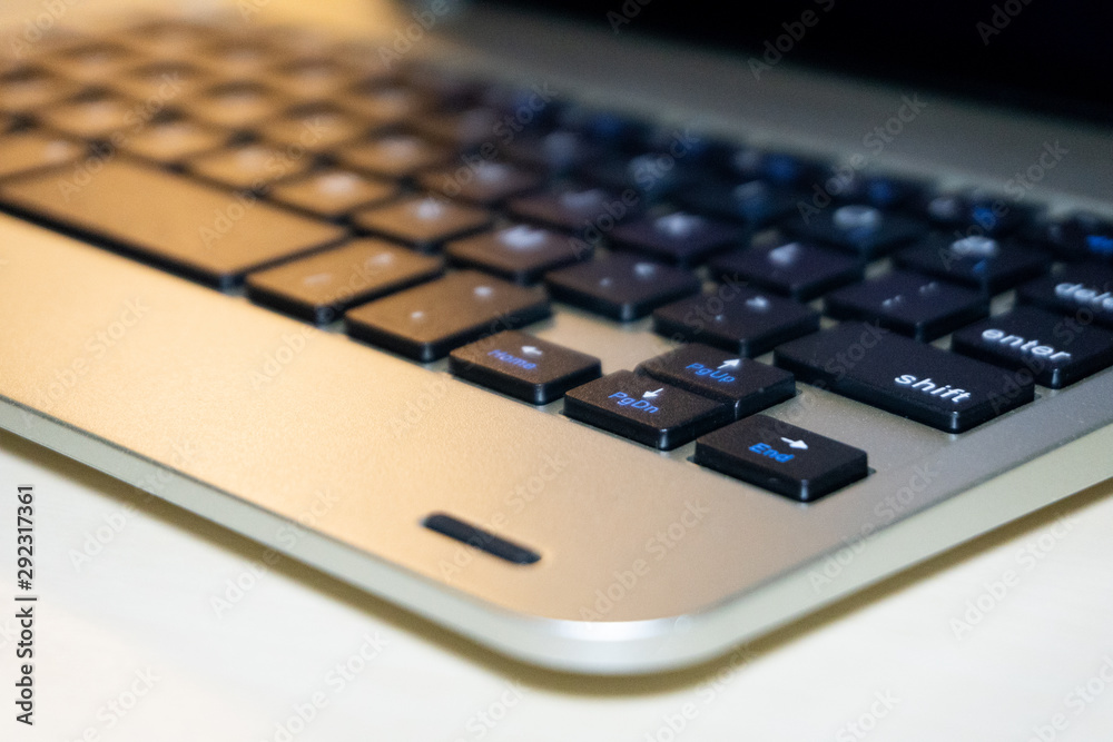Closeup of  laptop keyboard  with selective focus and blurry background. Business concept and Copy space