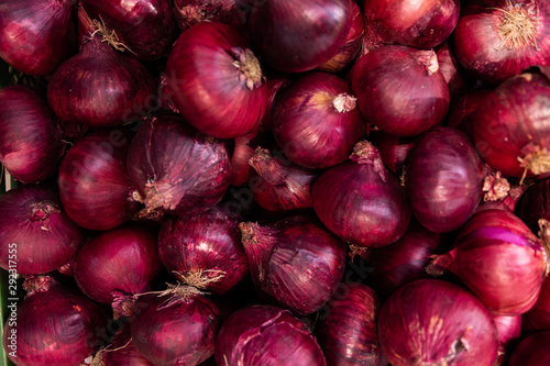 Red onions in a bunch at background. vegetable Close-up, salad ingredient