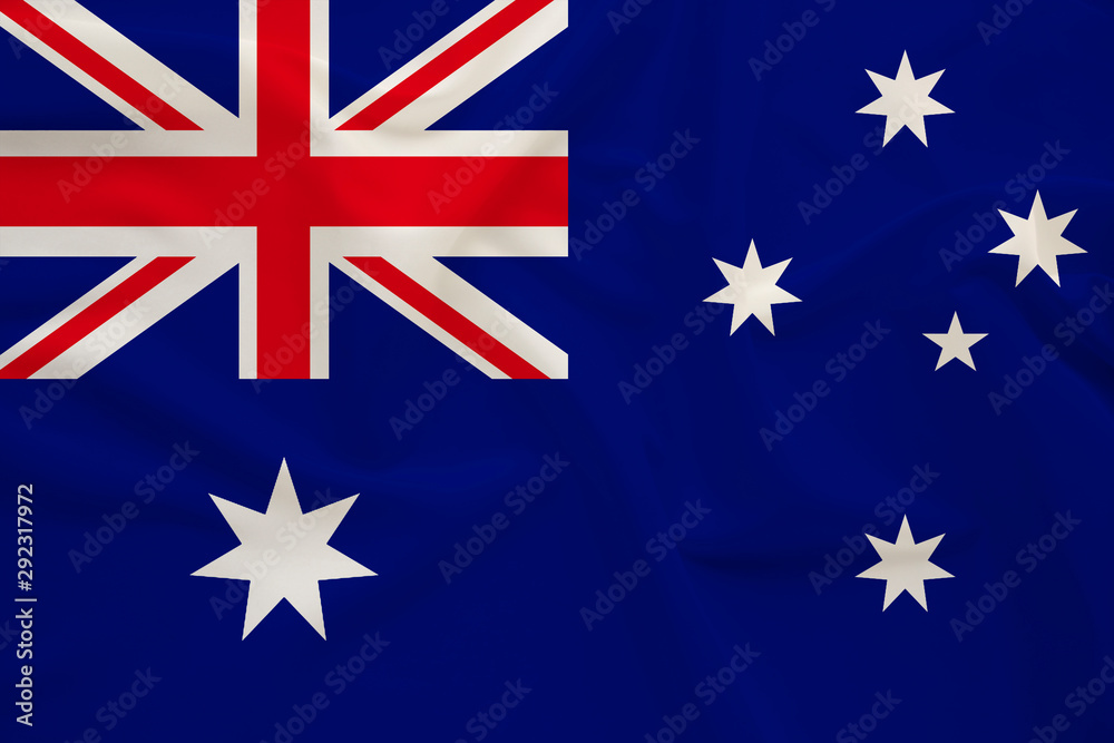 Fototapeta premium national flag of Australia on delicate silk with wind folds, travel concept, immigration, politics