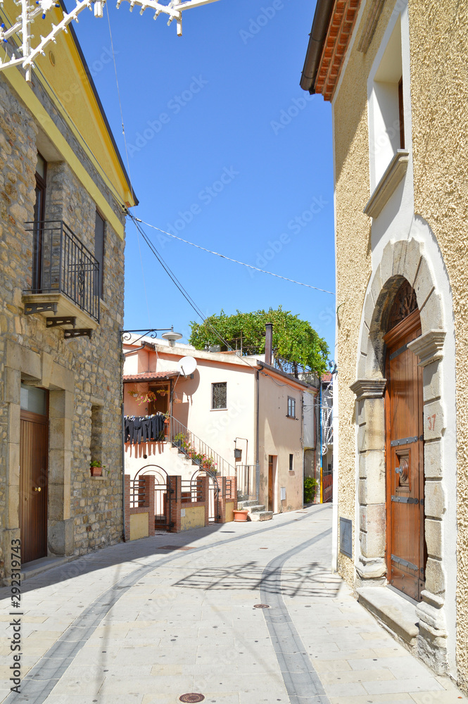 Brindisi di Montagna, a narrow street among the old houses of a mountain village in the Basilicata region.