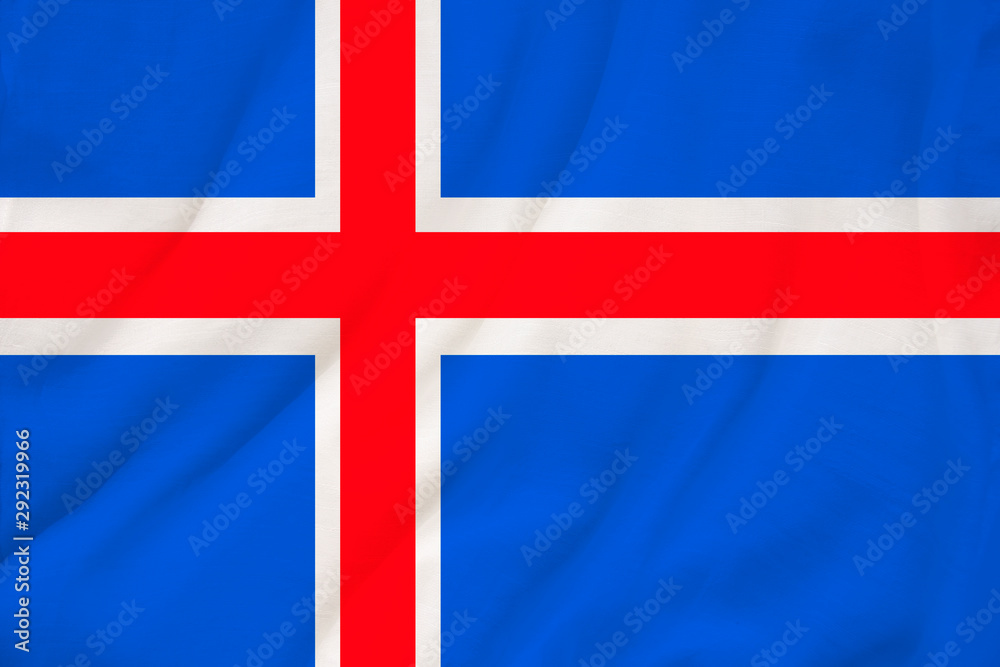 Fototapeta premium national flag of the country iceland on delicate silk with creases from the wind, concept of travel, immigration, politics, copy space, close-up