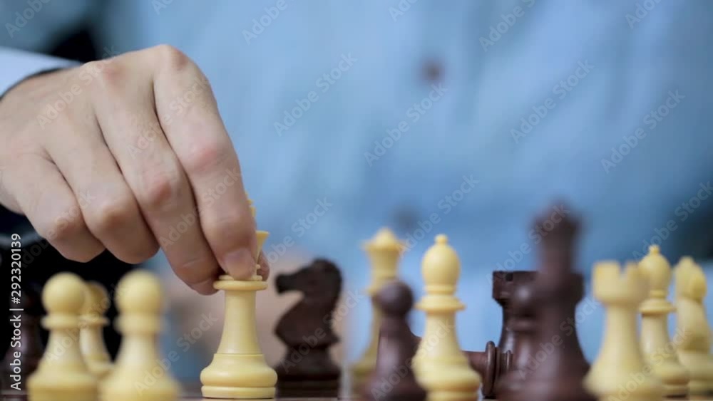 Businessman play with chess game in competition success play, concept strategy and successful management or leadership Businessman play with chess game in competition success play, concept strategy and successful management or leadership