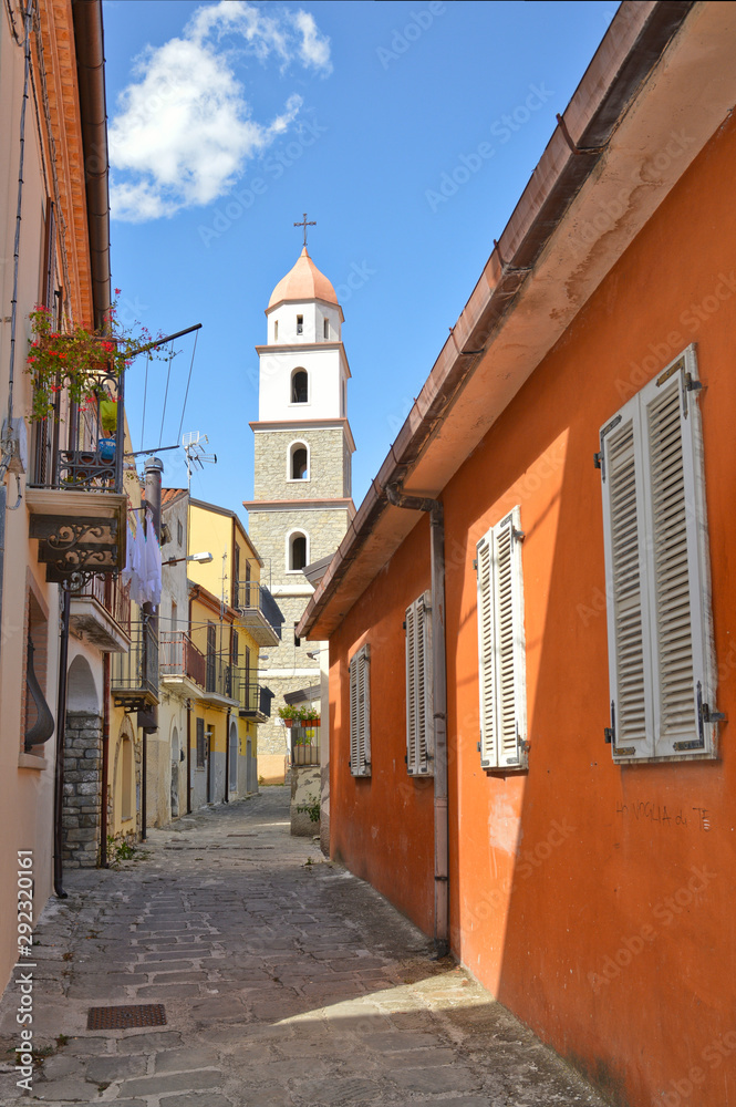 Brindisi di Montagna, a narrow street among the old houses of a mountain village in the Basilicata region.	