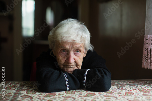 Portrait of a sad old woman. Care for lonely pensioners.