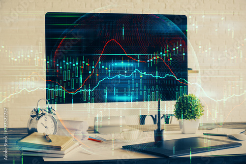 Double exposure of graph and financial info and work space with computer background. Concept of international online trading. © peshkova