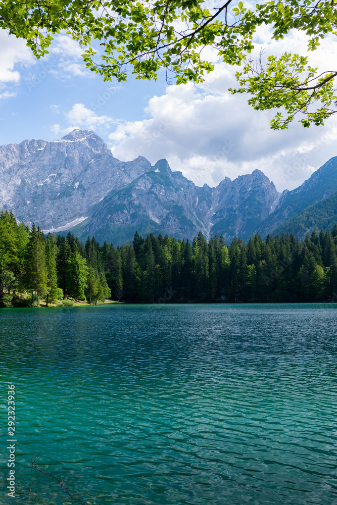 Beautiful land scape of Lago di Fusine, the lake with background of Julian alps in Italy.