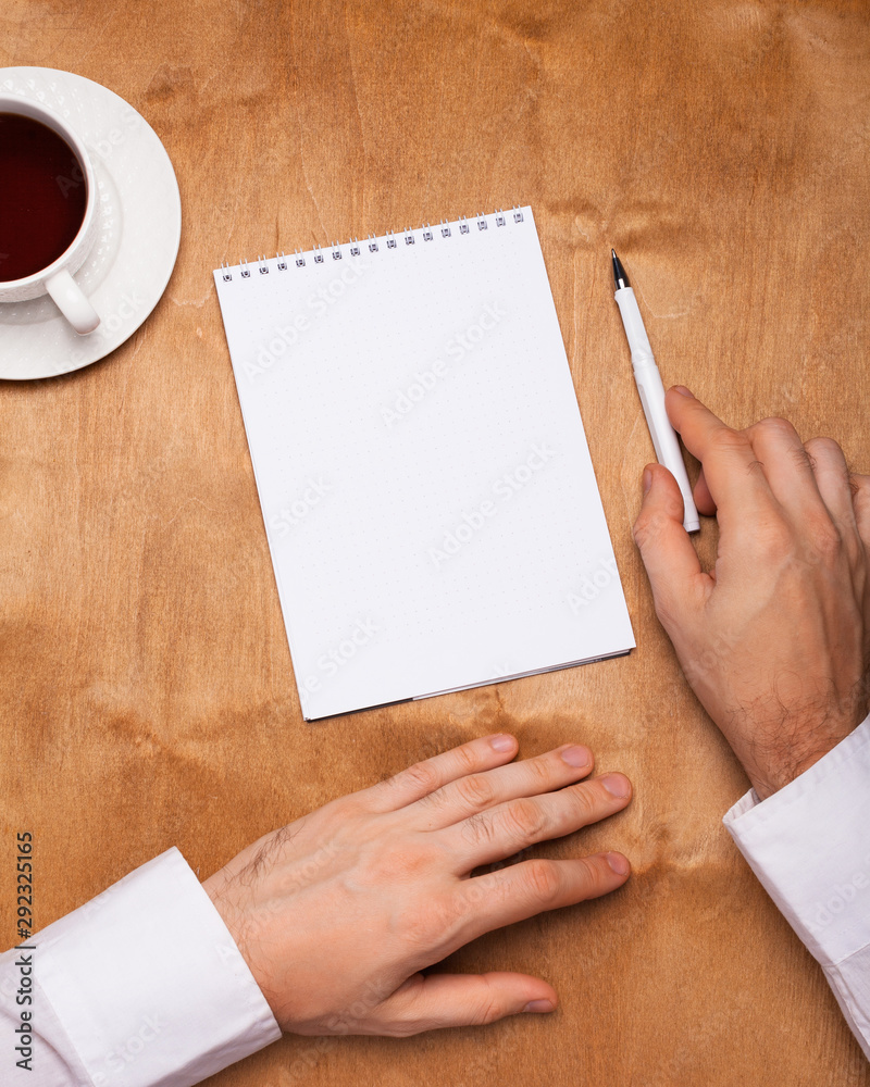 Obraz premium Planning 2020 in a notebook with men's hands