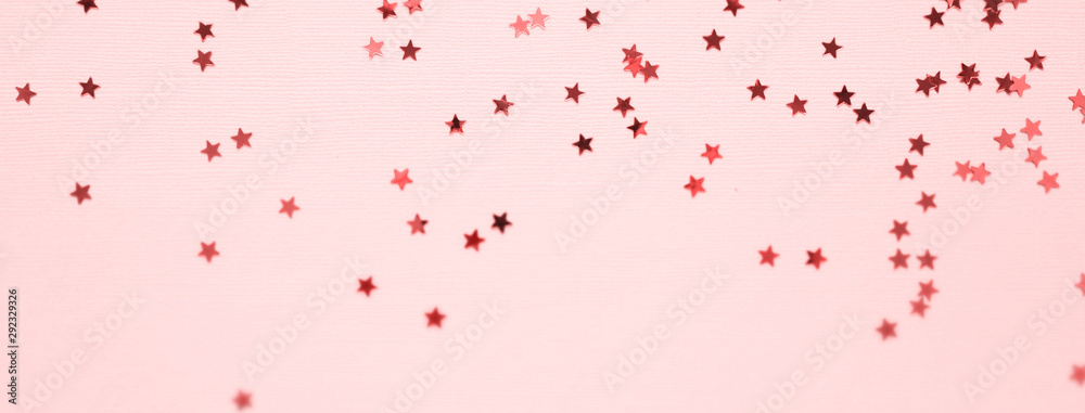 Golden stars glitter on pink background