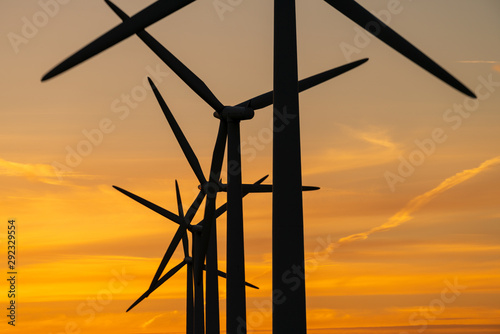 Wind turbine energy generaters on wind farm photo