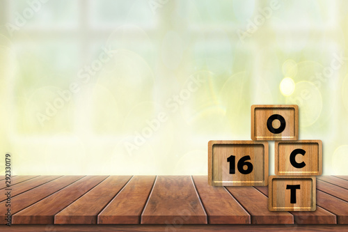 World food day concept: Alphabet 16 Oct wooden cube on wood table and bokeh background, banner with copy space for text