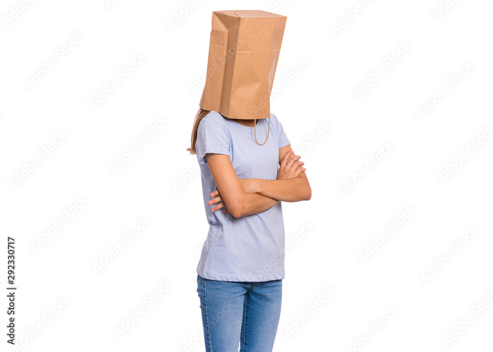Portrait of teen girl with paper bag over head. Teenager cover head with bag  with crossed arms isolated on white background. Child folded hands, pulling  paper bag over head. Stock Photo