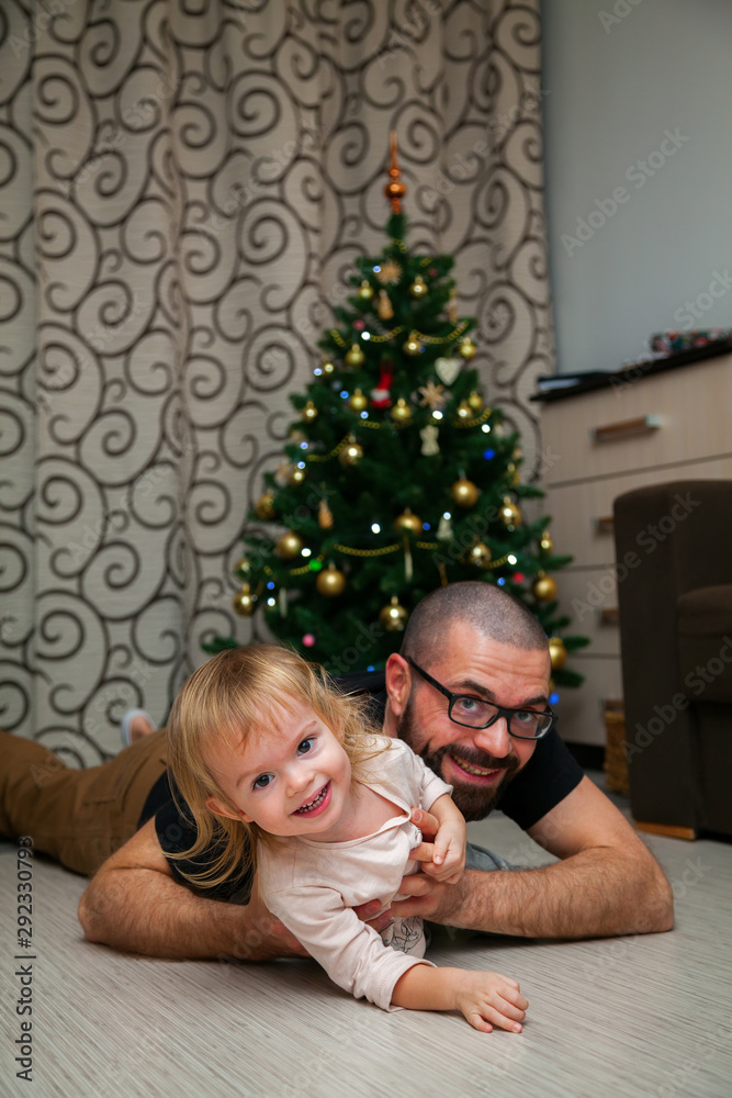 having fun near Christmas tree having fun near Christmas tree
