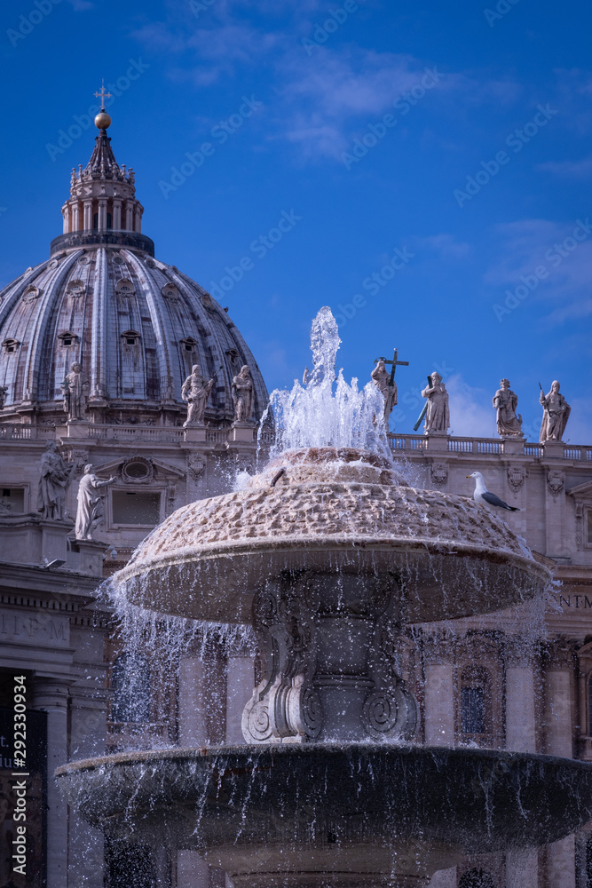 The dome and Bernini's fountain in St. Peter's square, Vatican City