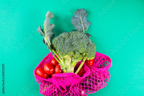 Zero waste concept. Reusable mesh shopping bag full of fresh produce. Plastic free lifestyle