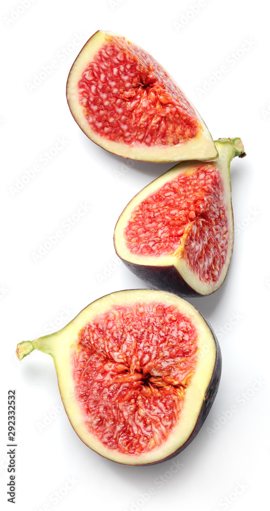 Slices of ripe figs isolated on a white background. Good texture and vibrant saturated colors. Top view. Slices of ripe figs isolated on a white background. Good texture and vibrant saturated colors. Top view.