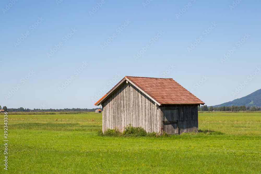Barn on a pasture in the Alpine foothills Barn on a pasture in the Alpine foothills