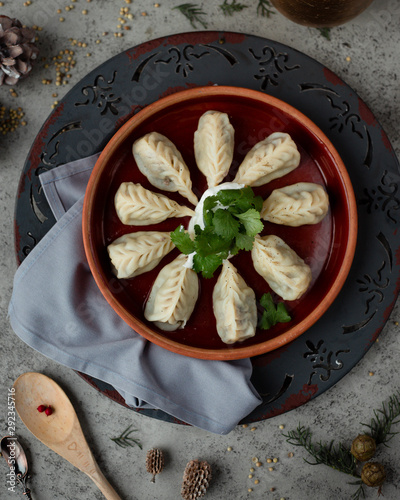 Gurza traditional dumplings with meat, served with yoghurt photo