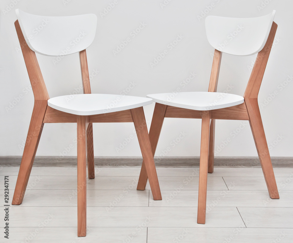 Fototapeta premium Two modern wooden chairs in the kitchen