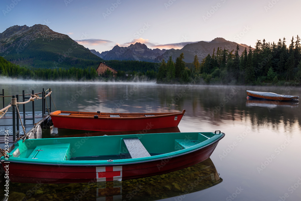 Late summer sunrise on mountain lake in High Tatra (Strbske Pleso, Slovakia)