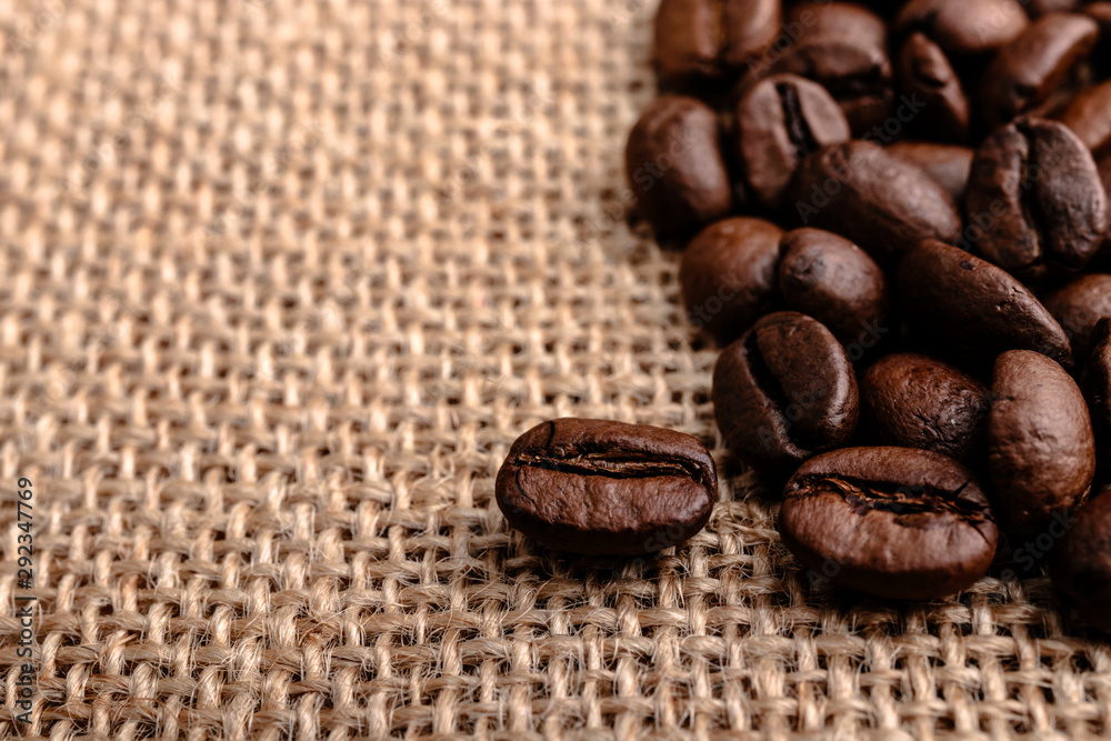 Coffee beans on burlap background Coffee beans on burlap background