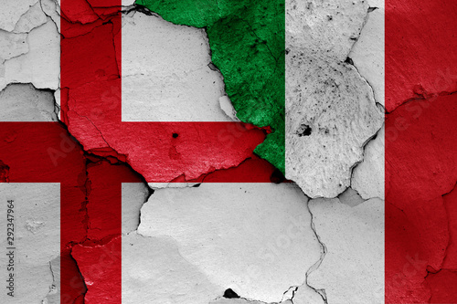 flags of England and Italy painted on cracked wall