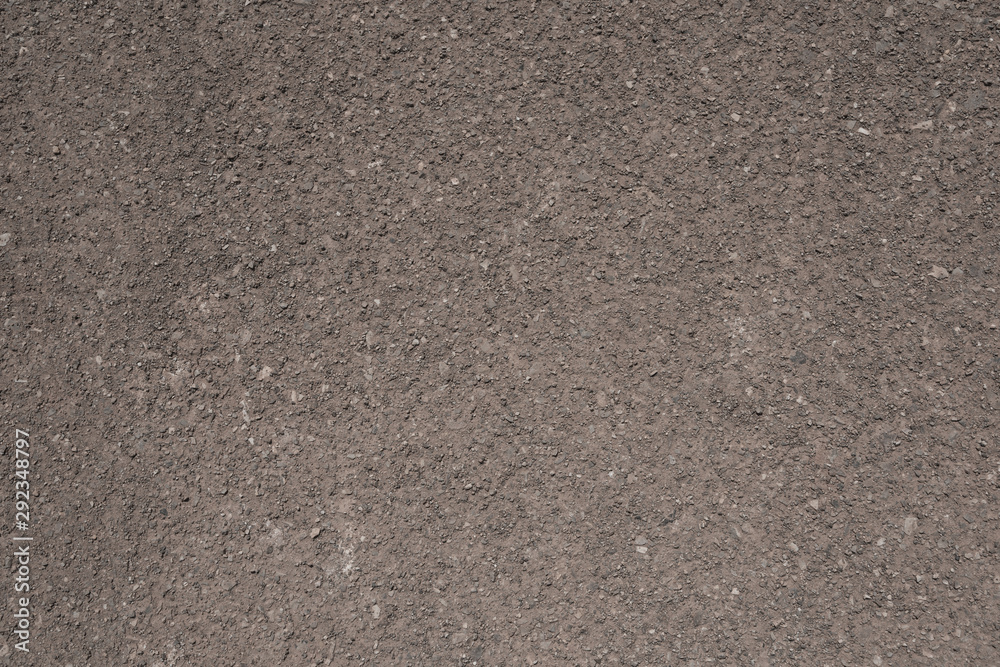 Fototapeta premium Brown building silt fine sand grunge texture background closeup