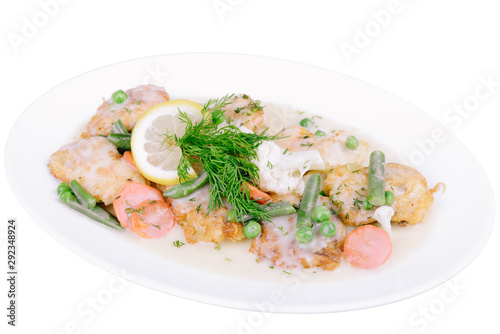 Grilled fish fillet in sauce with asparagus isolated on a white background