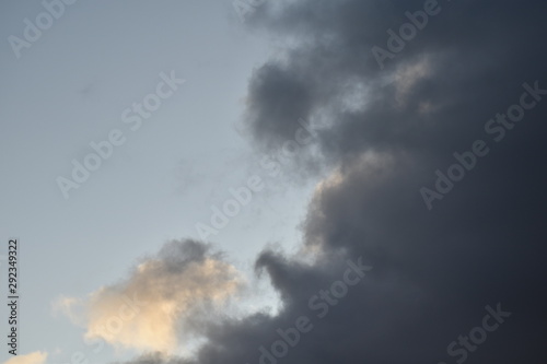 beautiful landscape panorama with blue sky, clouds and sunset. panoramic view of sunrise, a new day. sun rays shine through clouds