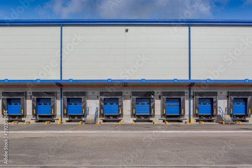 A large empty distribution warehouse with several loading bays