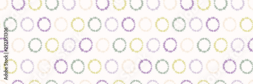 Dotty shibori tie dye sunburst circle border background. Seamless pattern on bleached resist white ribbon. Pastel dyed ink ring batik edging trim. Trendy retro gender neutral kid washi tape banner