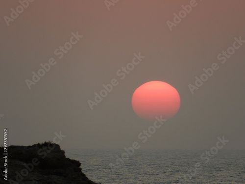 sunset over the Aegean sea, Lefkos, Karpathos island, Dodecanese, Greece photo