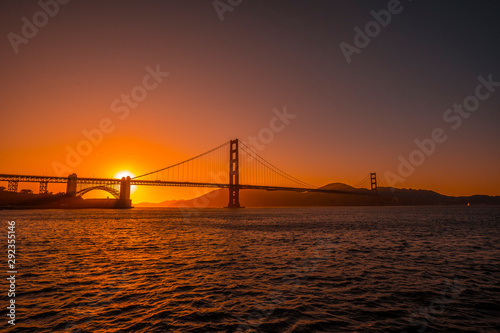 San Francisco, California / United States »  August 2019: Red sunset at the Golden Gate of San Francisco with the sun hiding on the bridge © unai