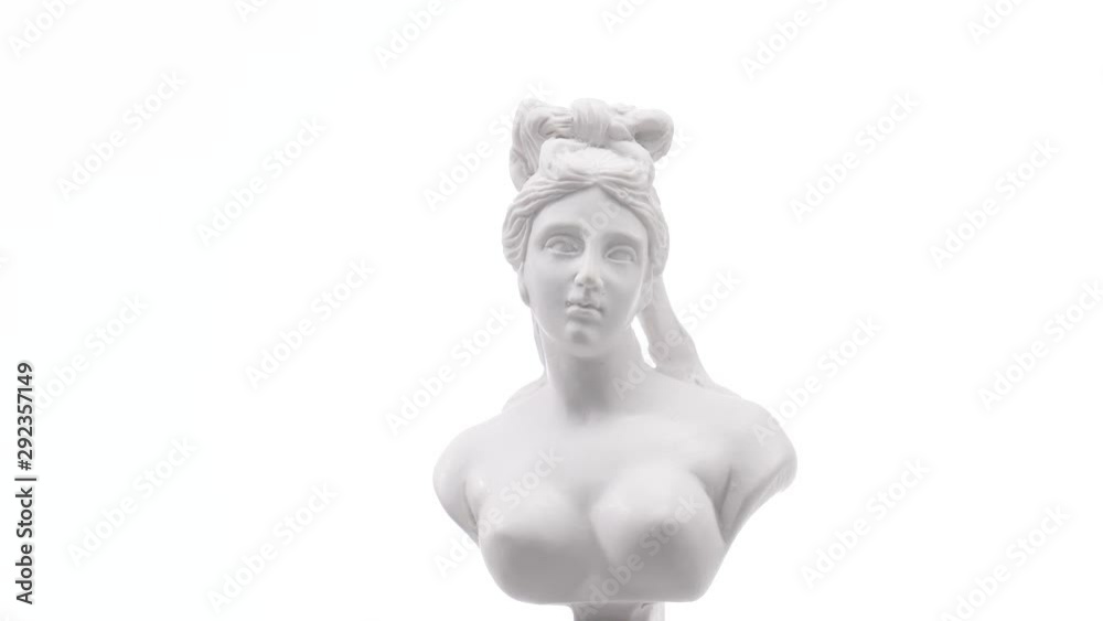 Old roman white marble statue rotating against a white background. Closeup shot Old roman white marble statue rotating against a white background. Closeup shot