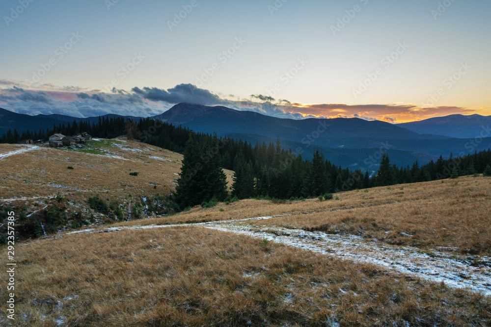 Fabulous Carpathian Mountains in the cold season with fantastic sky and clouds