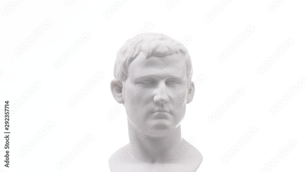 Old roman white marble statue rotating against a white background. Closeup shot Old roman white marble statue rotating against a white background. Closeup shot