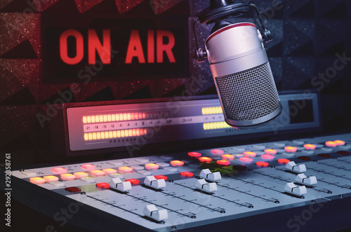 Professional microphone and sound mixer in radio studio photo
