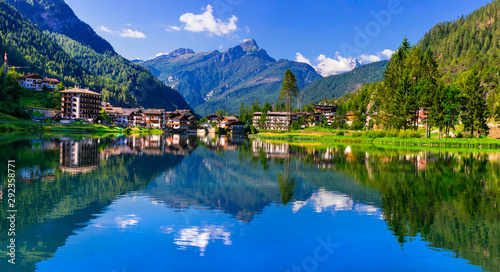 Amazing alpine scenery, Dolomites mountains. Beautiful lake lago di Alleghe. northen Italy