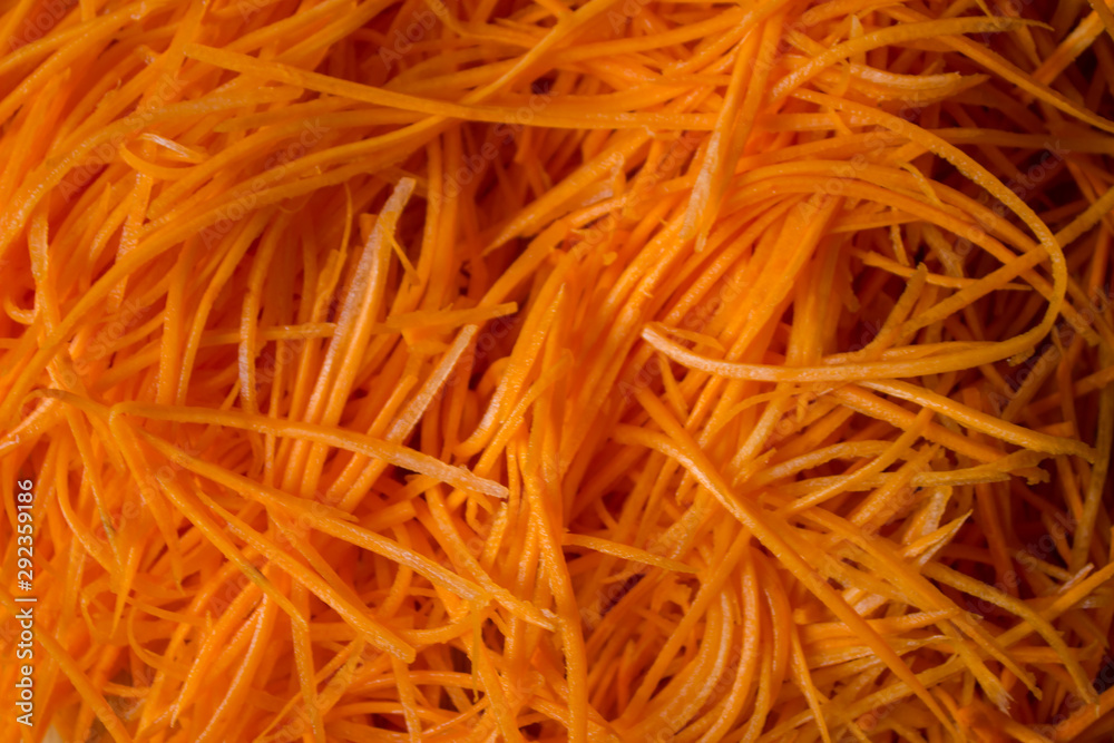 The carrots are polished on a turkish salt shaker. Carrot Background. Chopped carrot. Culinary background. copy space. top view. flat lay. background with blank space for text The carrots are polished on a turkish salt shaker. Carrot Background. Chopped carrot. Culinary background. copy space. top view. flat lay. background with blank space for text