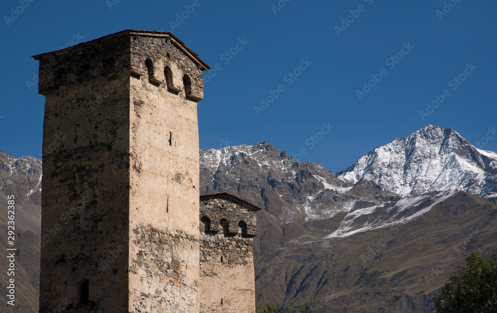 Stone towers against  mountains landscape