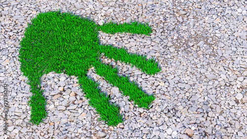 Concept or conceptual green grass handprint on gravel background. A metaphor for ecology, environment, recycle, nature conservation, spring, summe or protection against global warming 3d illustration
