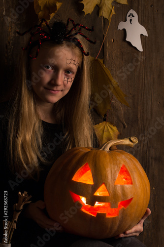 Halloween girl with a pumpkin