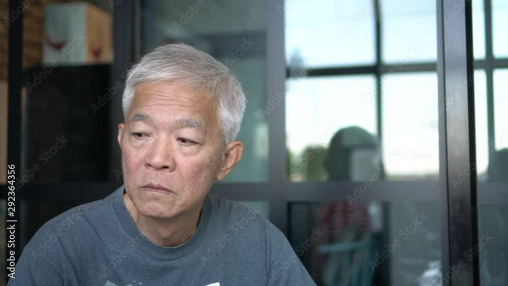 Asian senior elderly man thinking window glass background Asian senior elderly man thinking window glass background